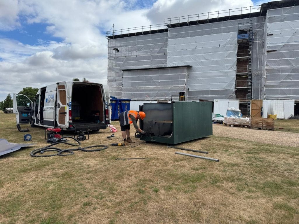 Commercial tank removal in progress by Eco Tank Services using specialist lifting equipment.